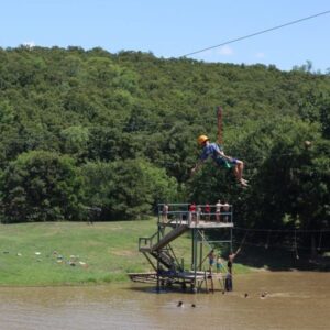 Awesome zip line over pond as Shepherd's Fold Ranch an Oklahoma summer camp