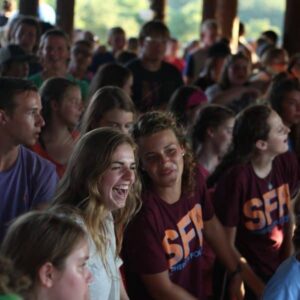 Christian camp Shepherd's Fold Ranch has campers at a night meeting