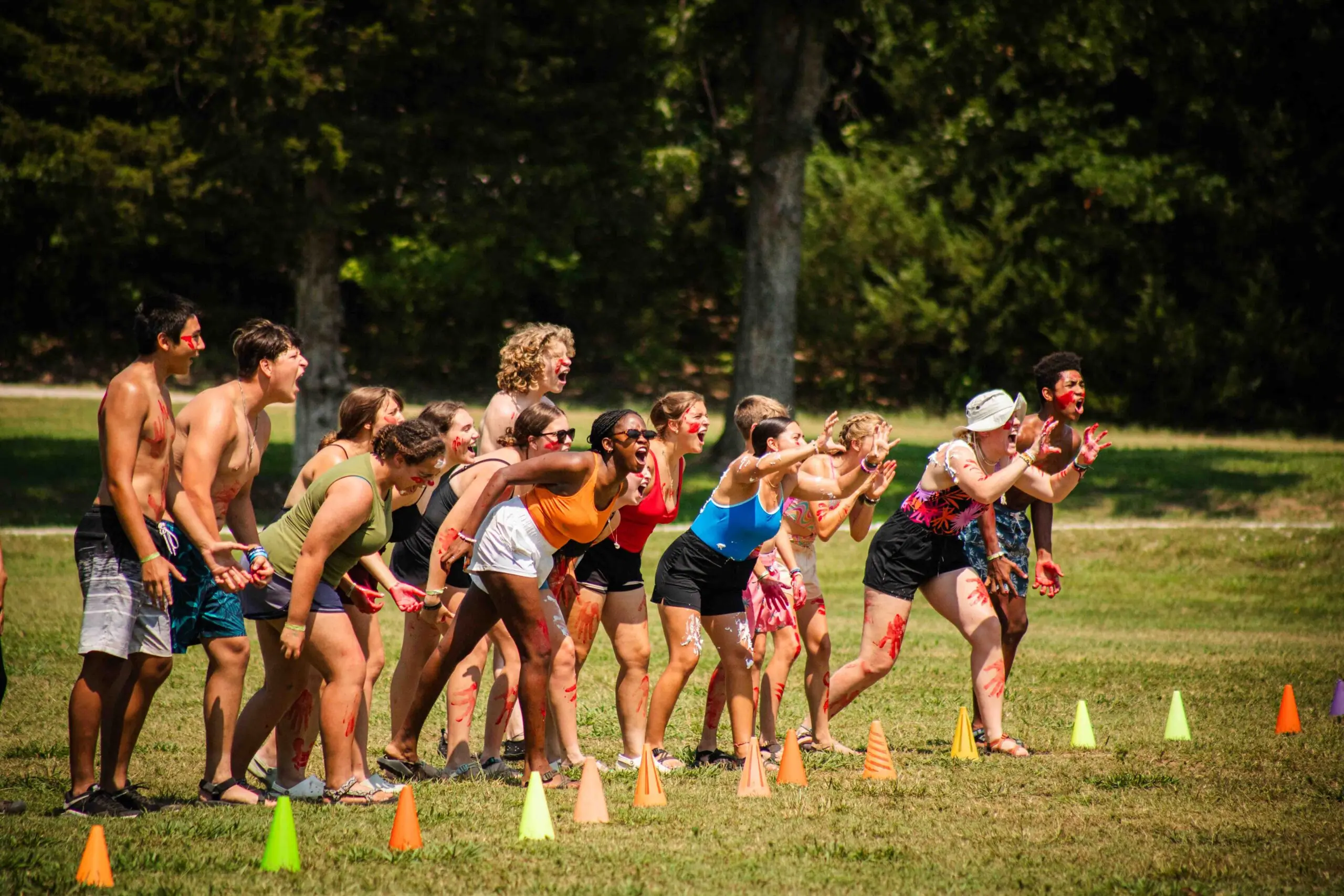 Group playing outdoor game with cones.